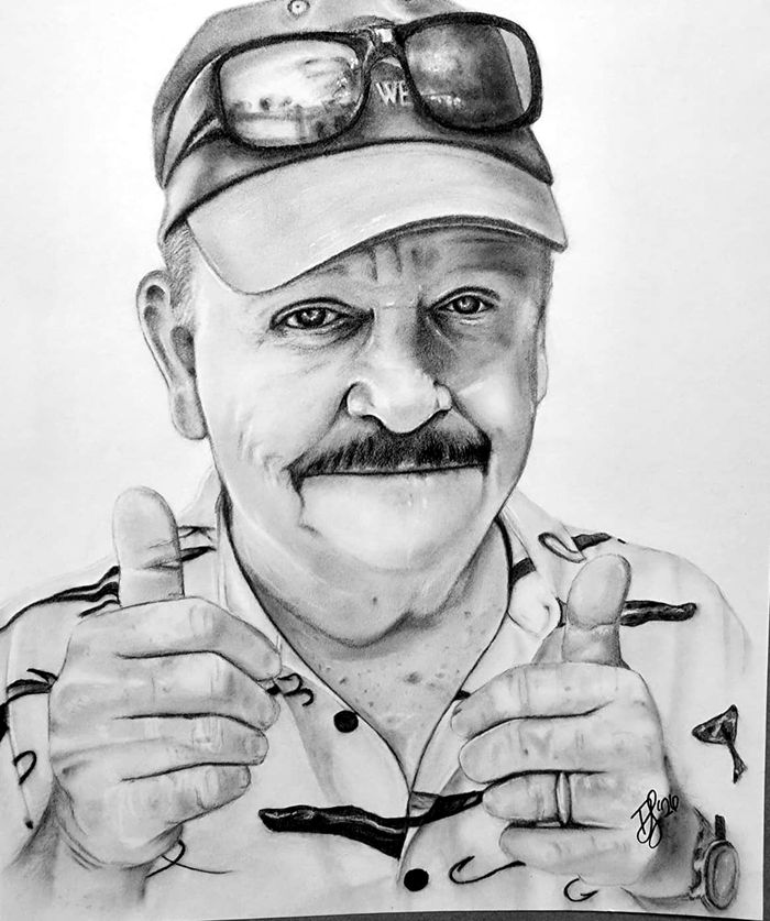 Graphite portrait of a man giving two thumbs up